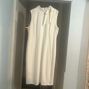 White Calvin Klein sleeveless dress with a bow on collar